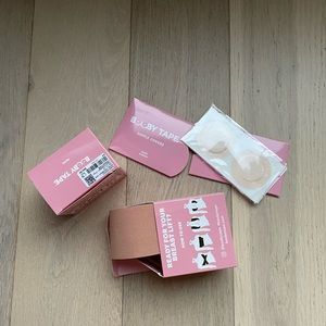 Booby tape package with tape and nipple covers